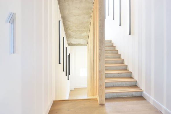 Linear wall lighting for stairwells and interior spaces.