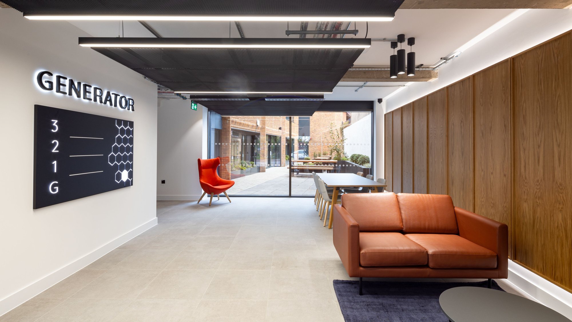 reception area with linear lighting and sofas