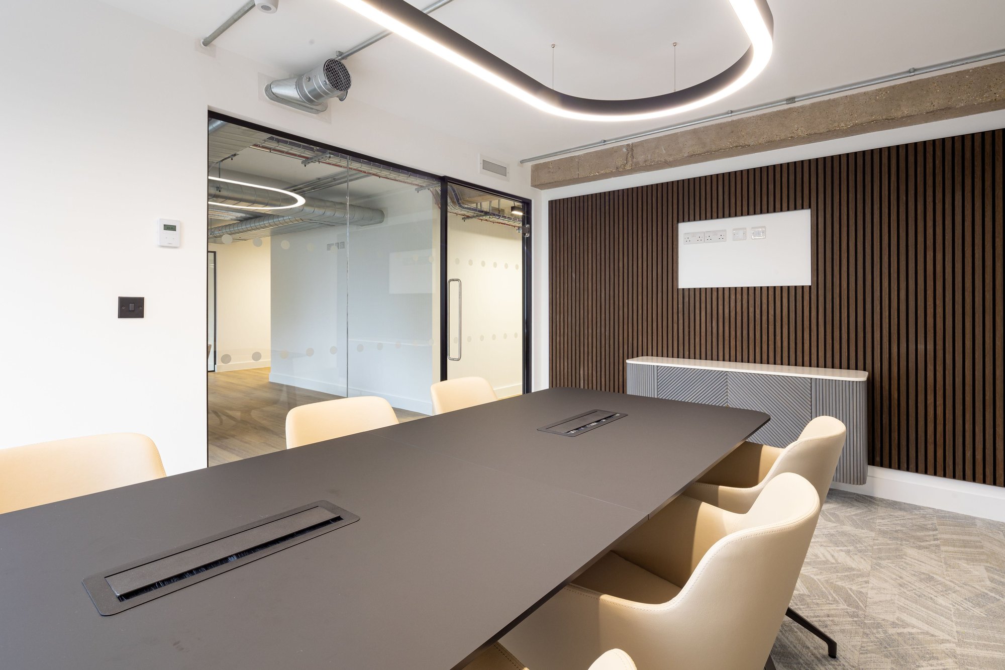 oval shaped feature lighting in a boardroom
