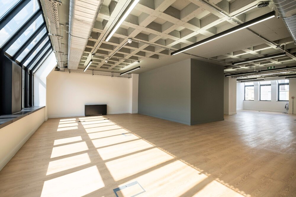 Office lighting for a CAT A fitout with concrete coffered slabs at 390 Strand, London.