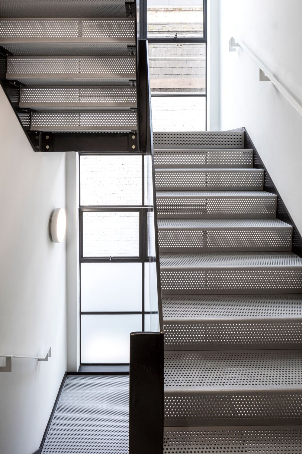 Office architectural lighting for a media style CAT A fitout at 82-84 Berwick Street, London.