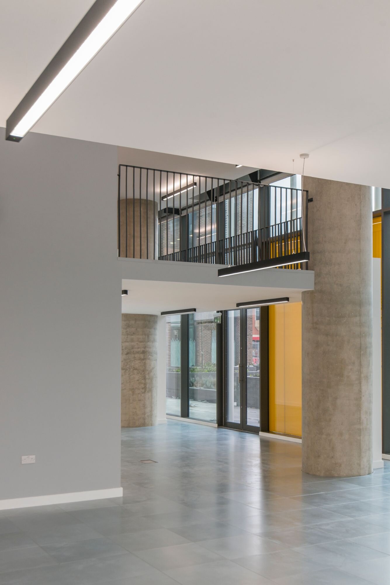 Contemporary office lighting for a CAT A fitout at Stratosphere Tower, London.