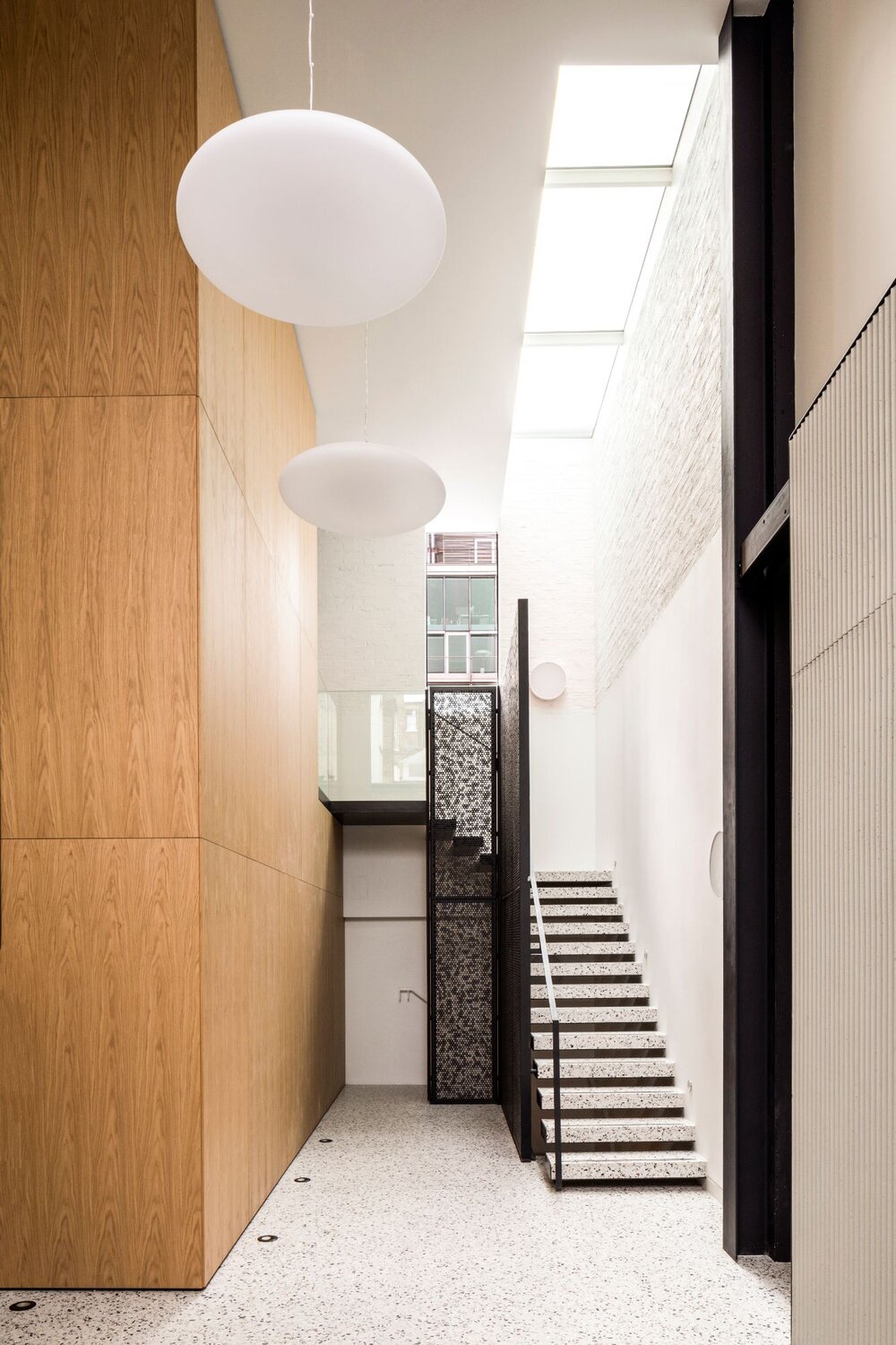 Office architectural lighting for a media style CAT A fitout at 82-84 Berwick Street, London.