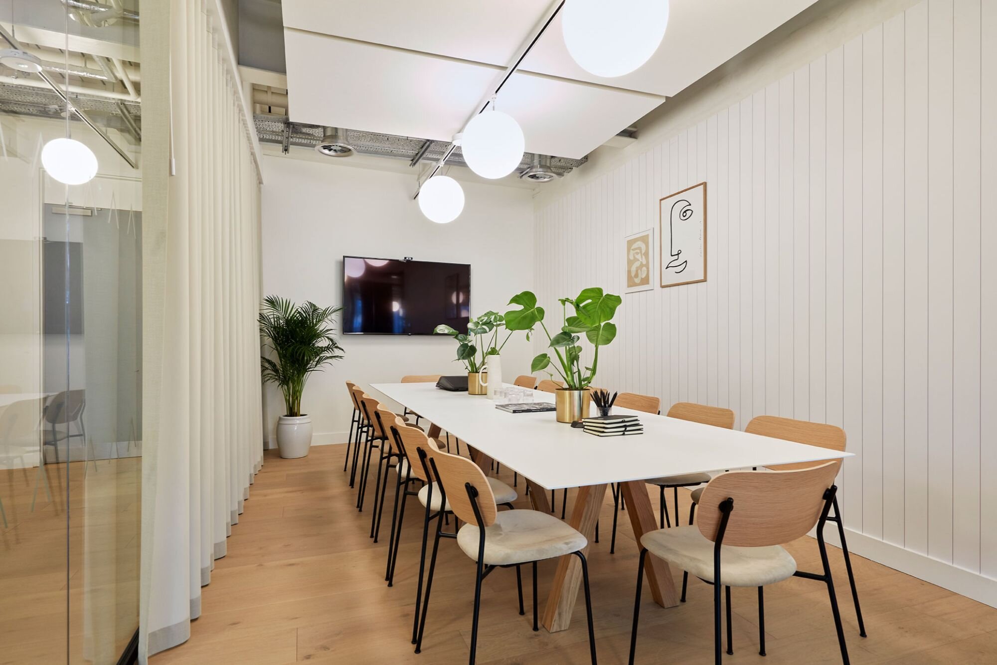 Suspended track lighting with decorative pendants at LABS 90 High Holborn, London.