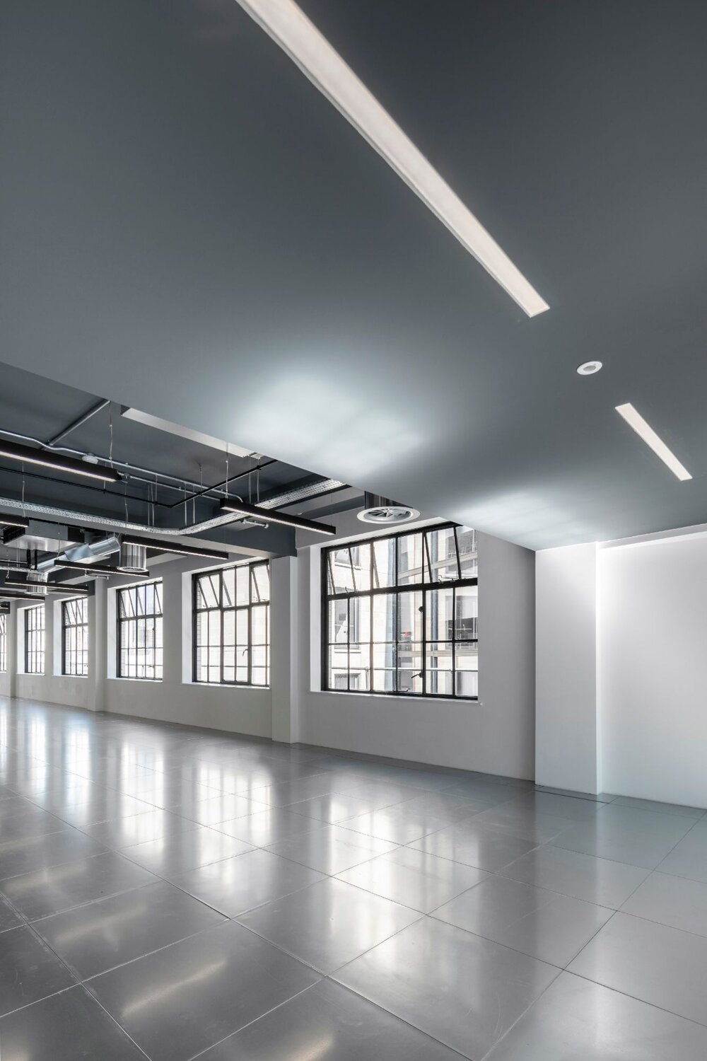 Office lighting for an industrial style CAT A fitout at 11 Old Jewry, London.