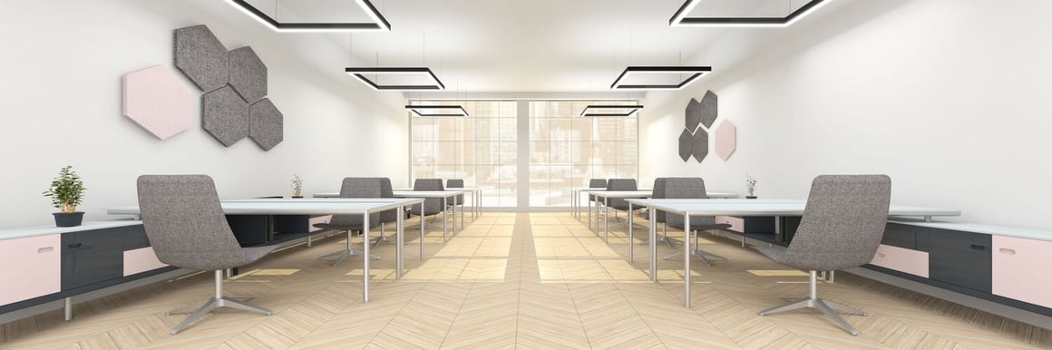 Square suspended light fittings for an office space.