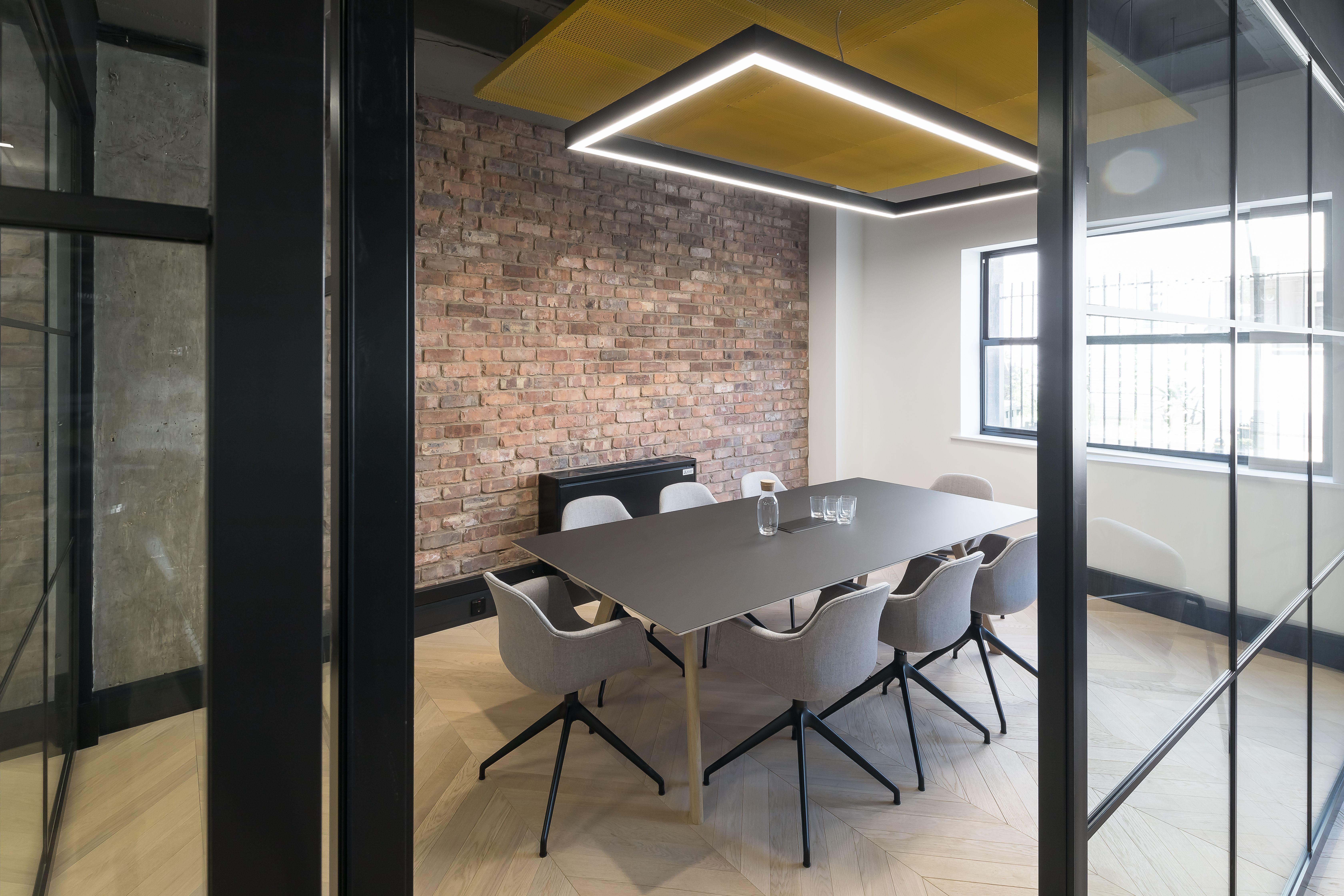 Office lighting for a CAT A+ fit out with exposed concrete soffits at 43 Eagle Street, London.