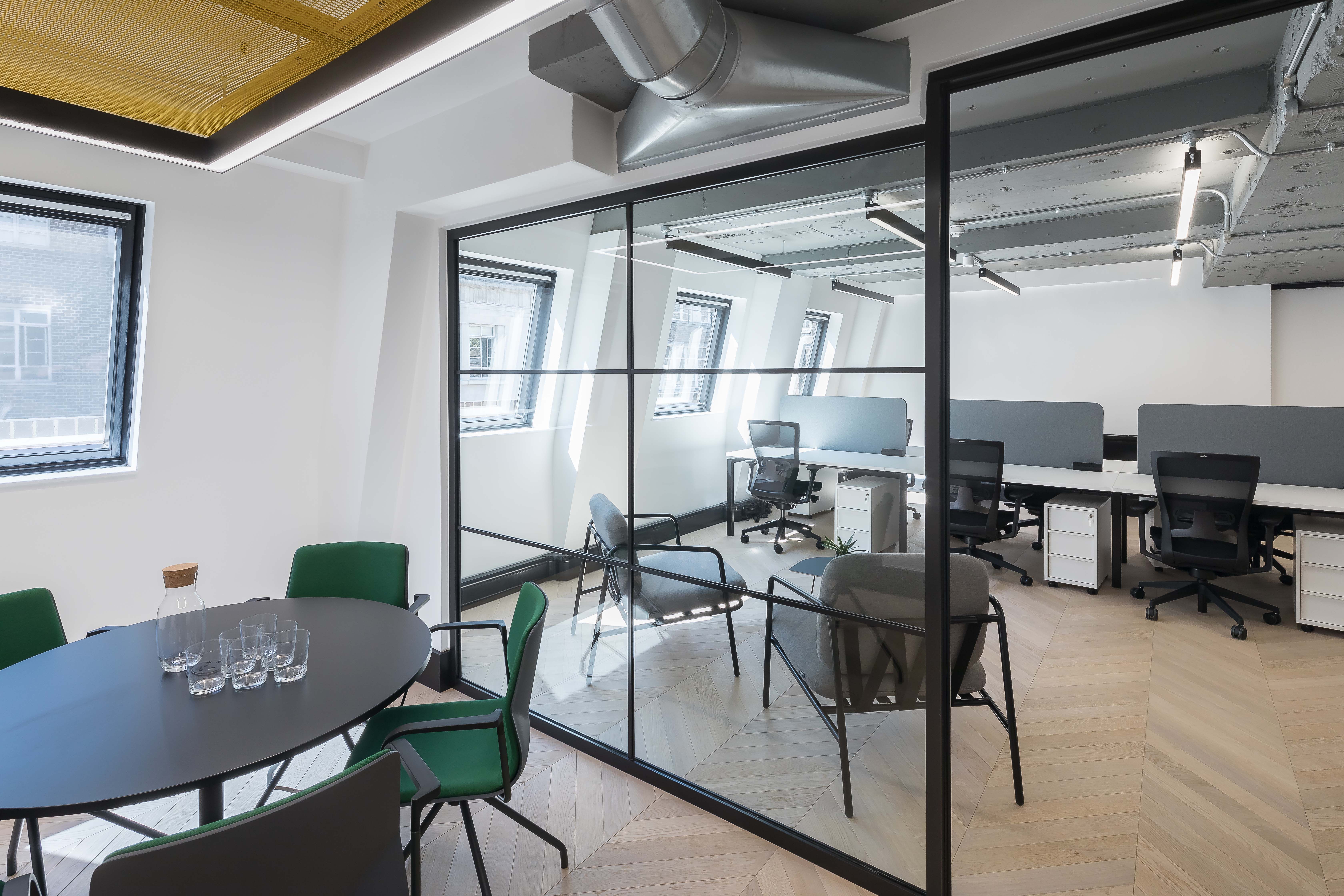 Office lighting for a CAT A+ fit out with exposed concrete soffits at 43 Eagle Street, London.