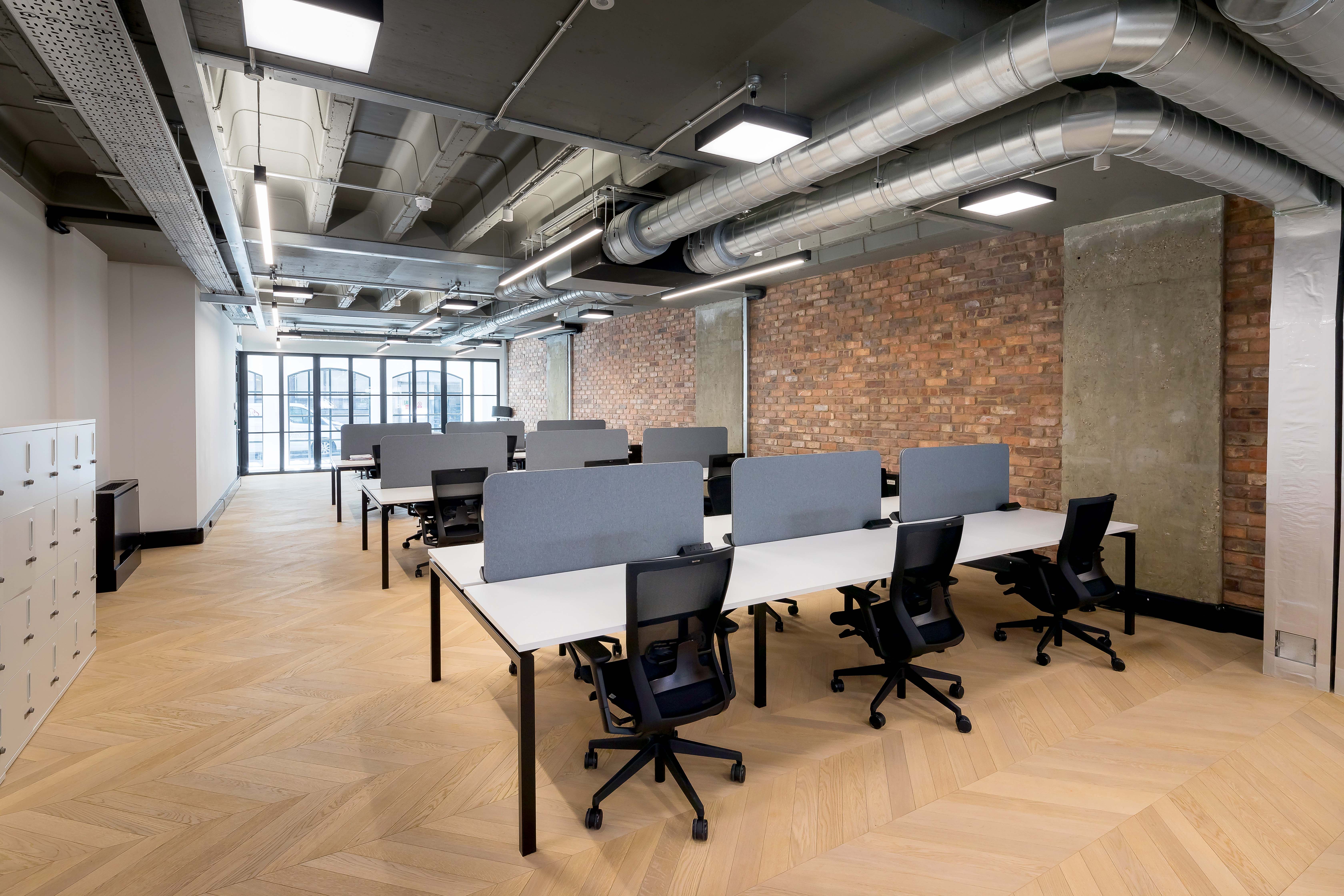 Office lighting for a CAT A+ fit out with exposed concrete soffits at 43 Eagle Street, London.