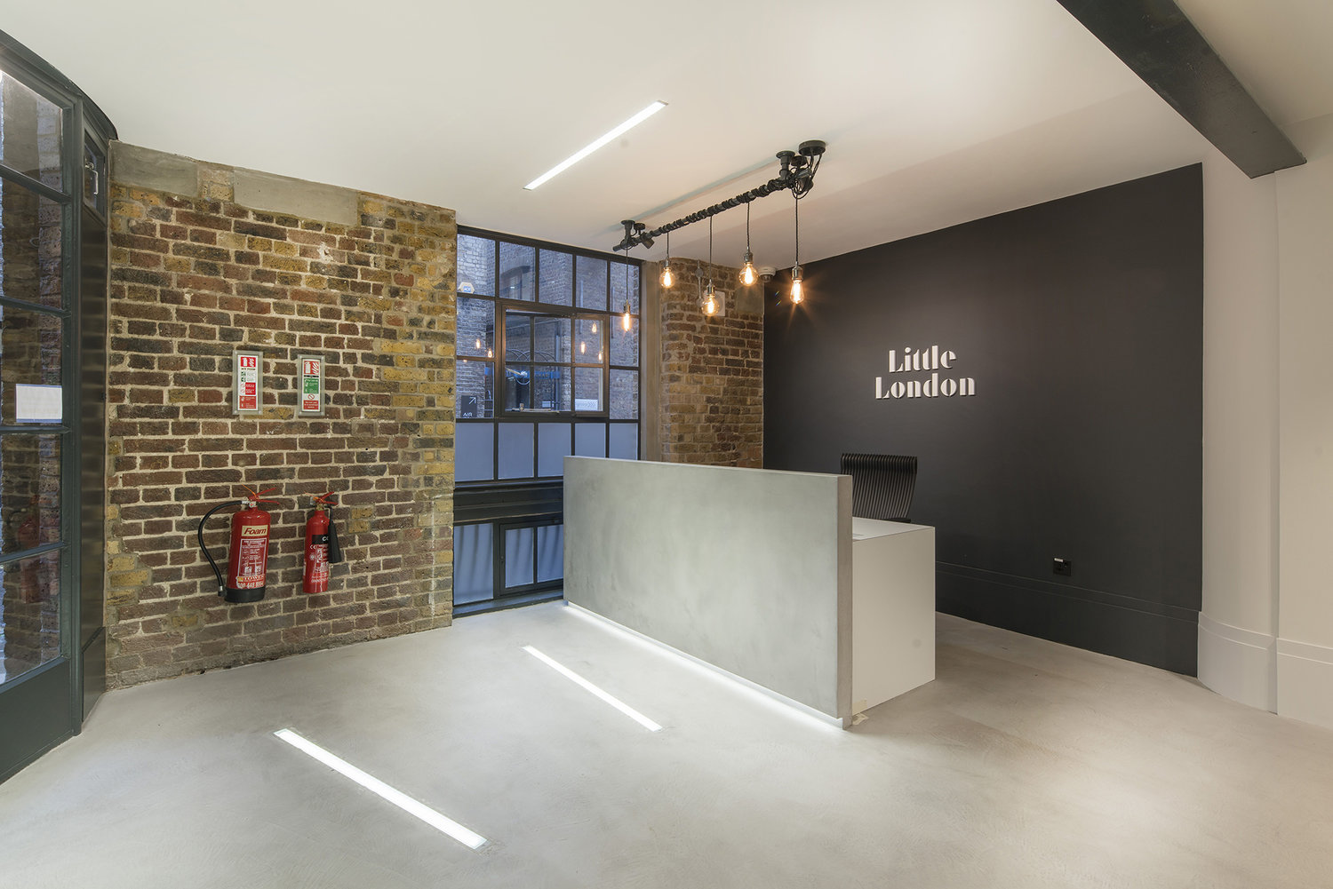 Lighting for an industrial style CAT A fitout at Little London, London.