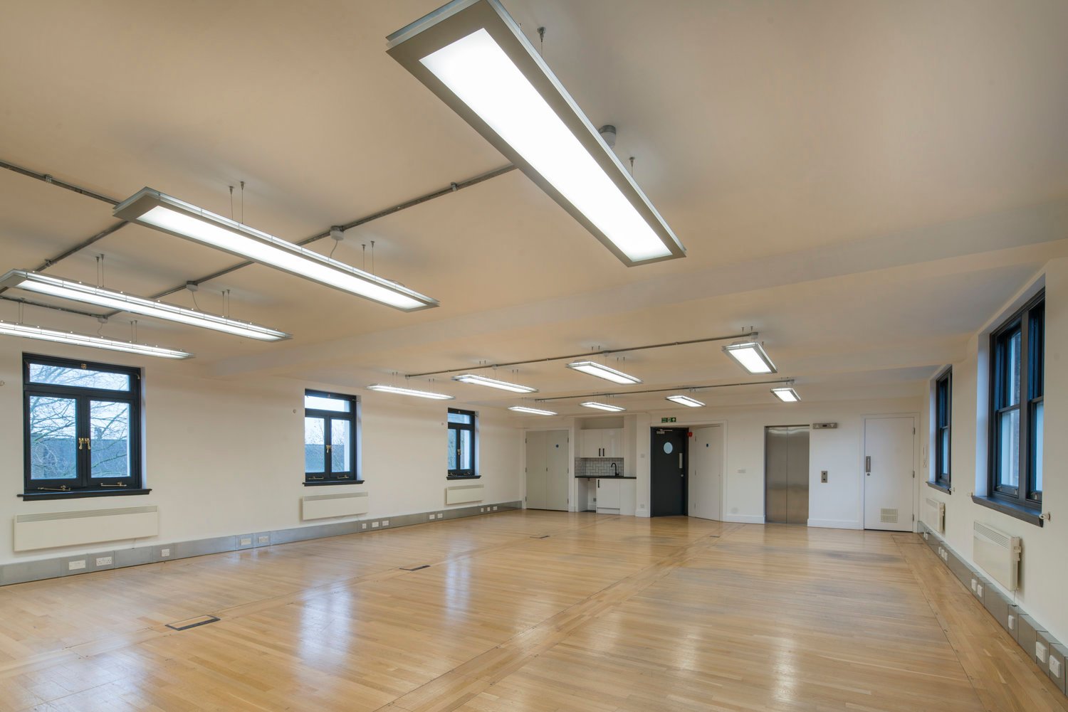 Lighting for an industrial style CAT A fitout at Little London, London.