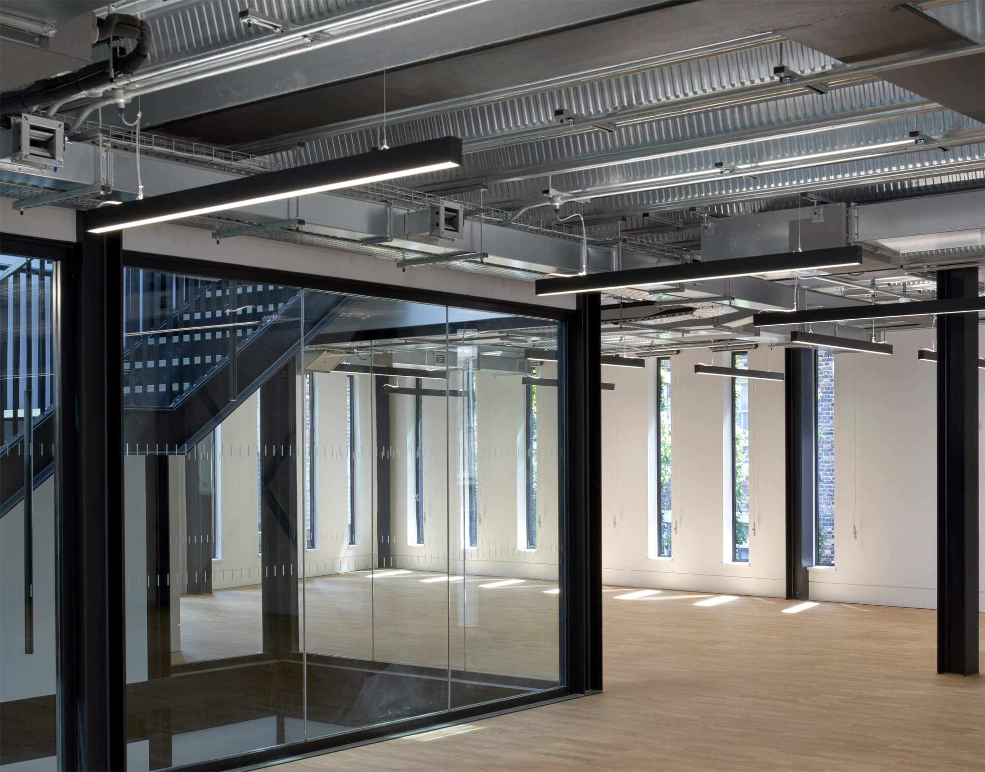 Office lighting for a sustainable BREEM-rated CAT A development at Plantworks, 1-3 Brittania Street, London.