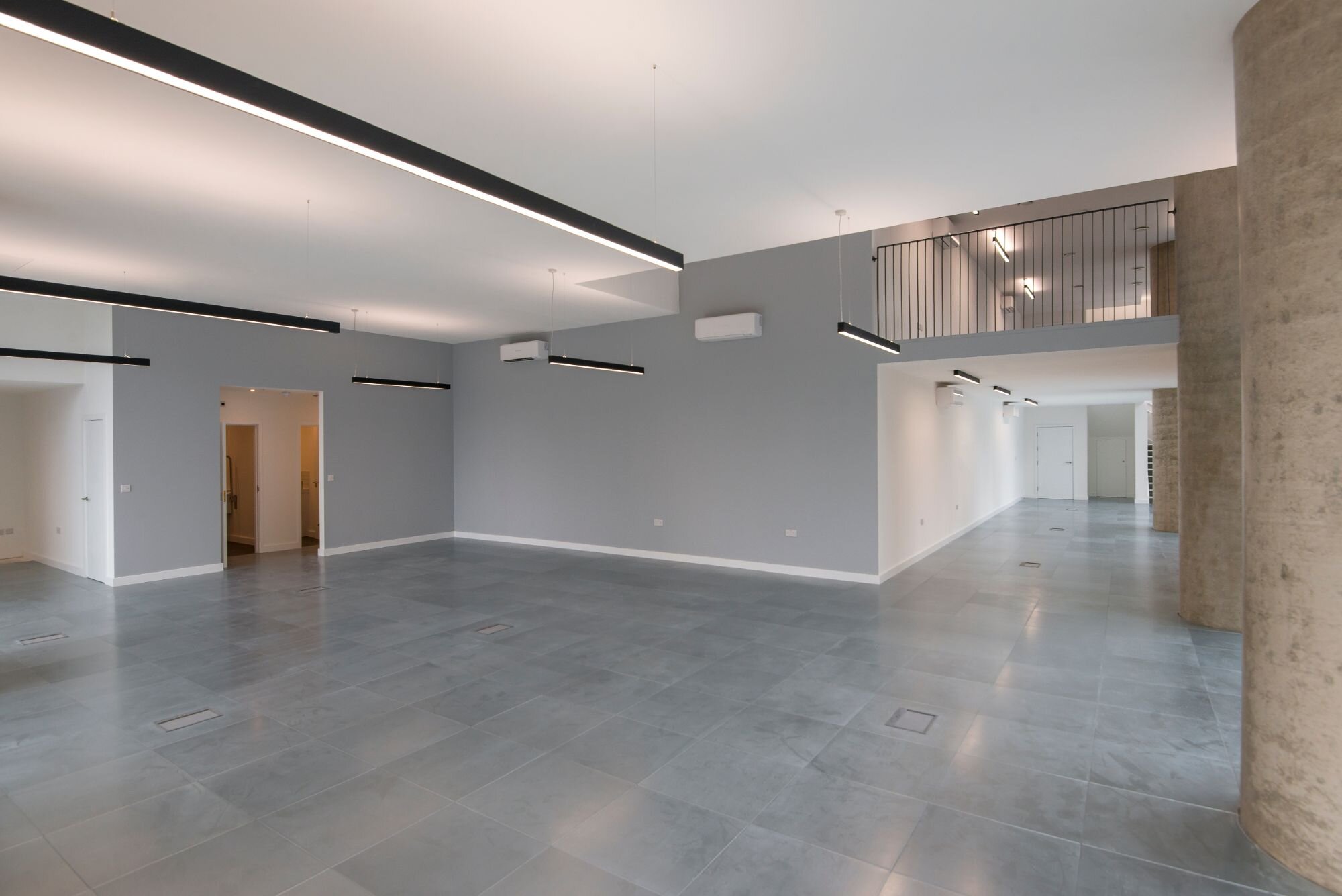 Contemporary office lighting for a CAT A fitout at Stratosphere Tower, London.