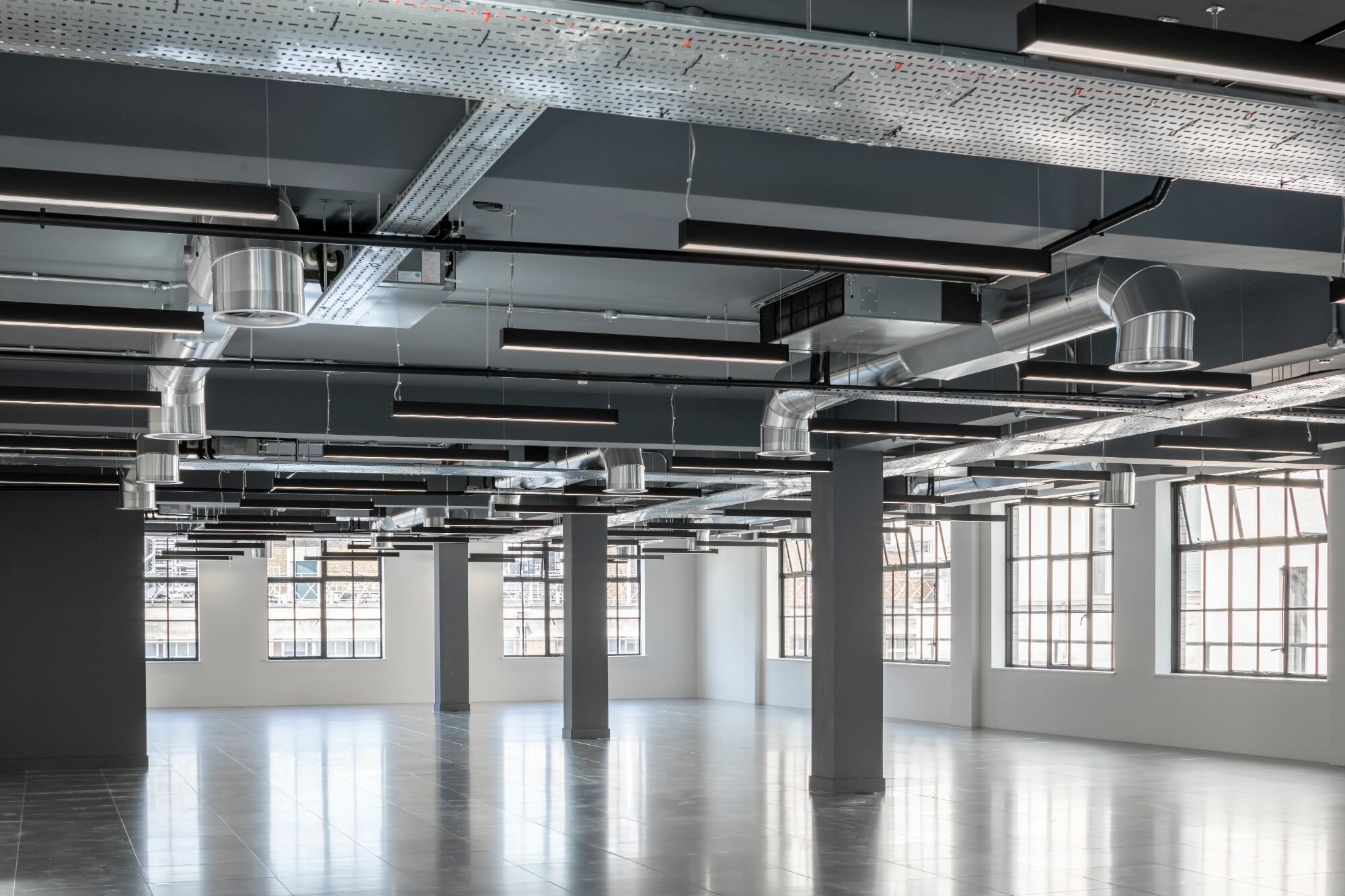 Office lighting for an industrial style CAT A fitout at 11 Old Jewry, London.