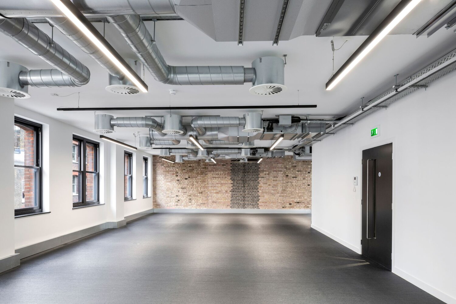 Office architectural lighting for a media style CAT A fitout at 82-84 Berwick Street, London.