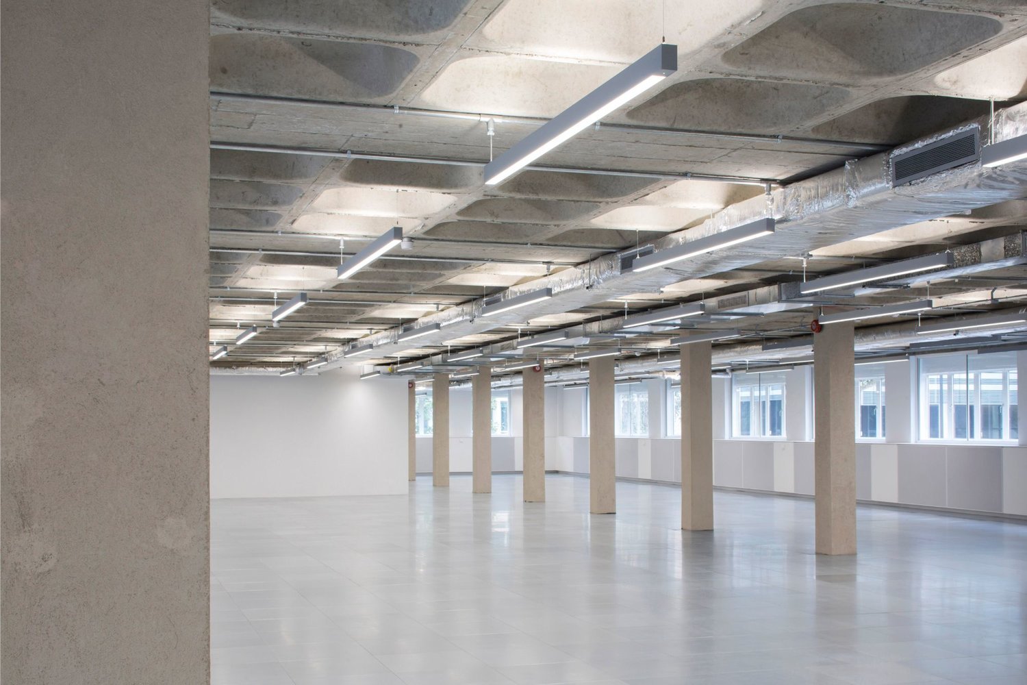 Bespoke architectural lighting for coffered slabs at Glen House, London.