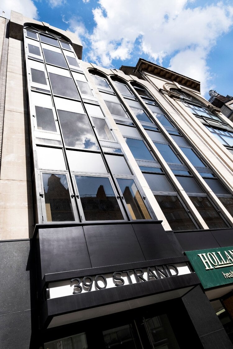 Office lighting for a CAT A fitout with concrete coffered slabs at 390 Strand, London.