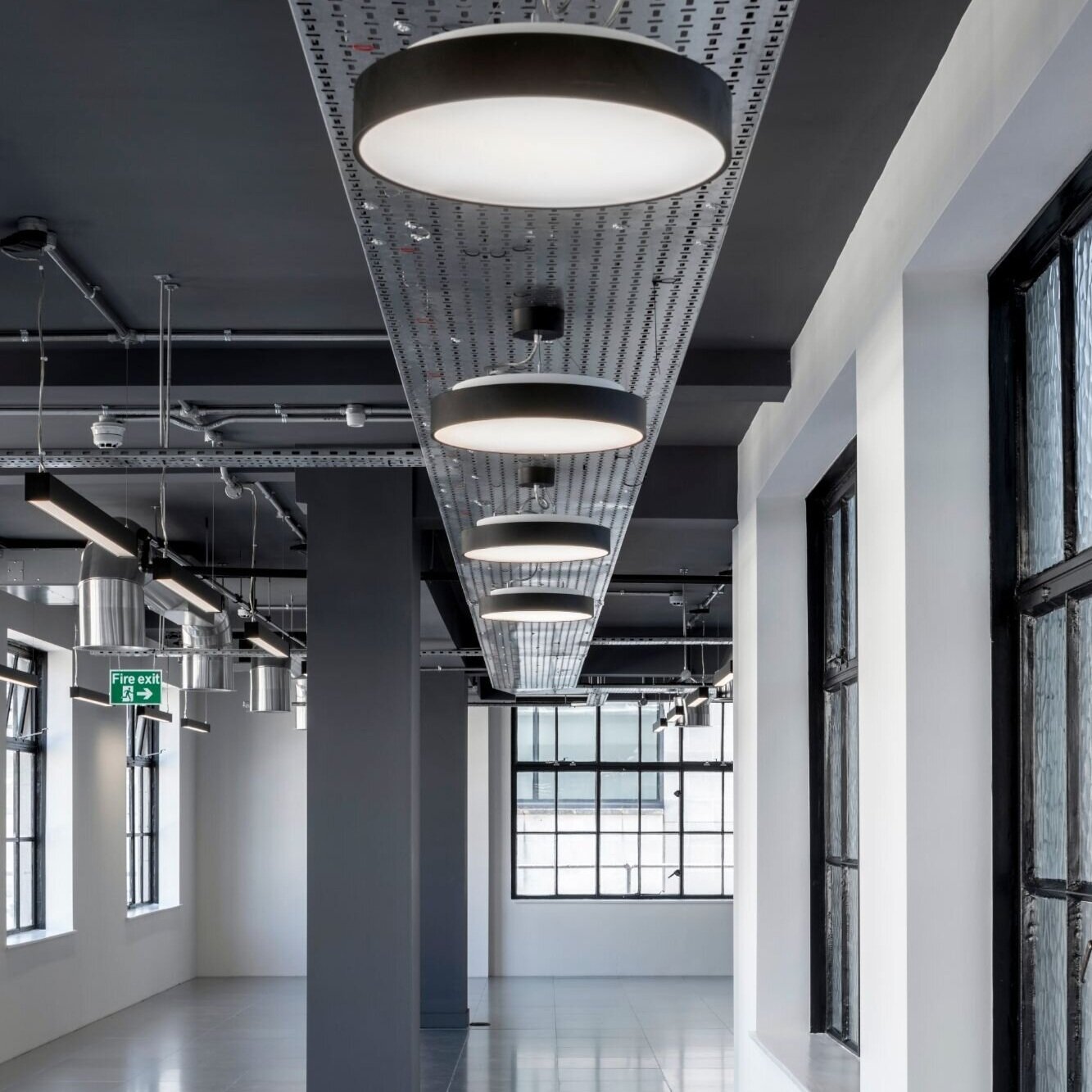 Office lighting for an industrial style CAT A fitout at 11 Old Jewry, London.
