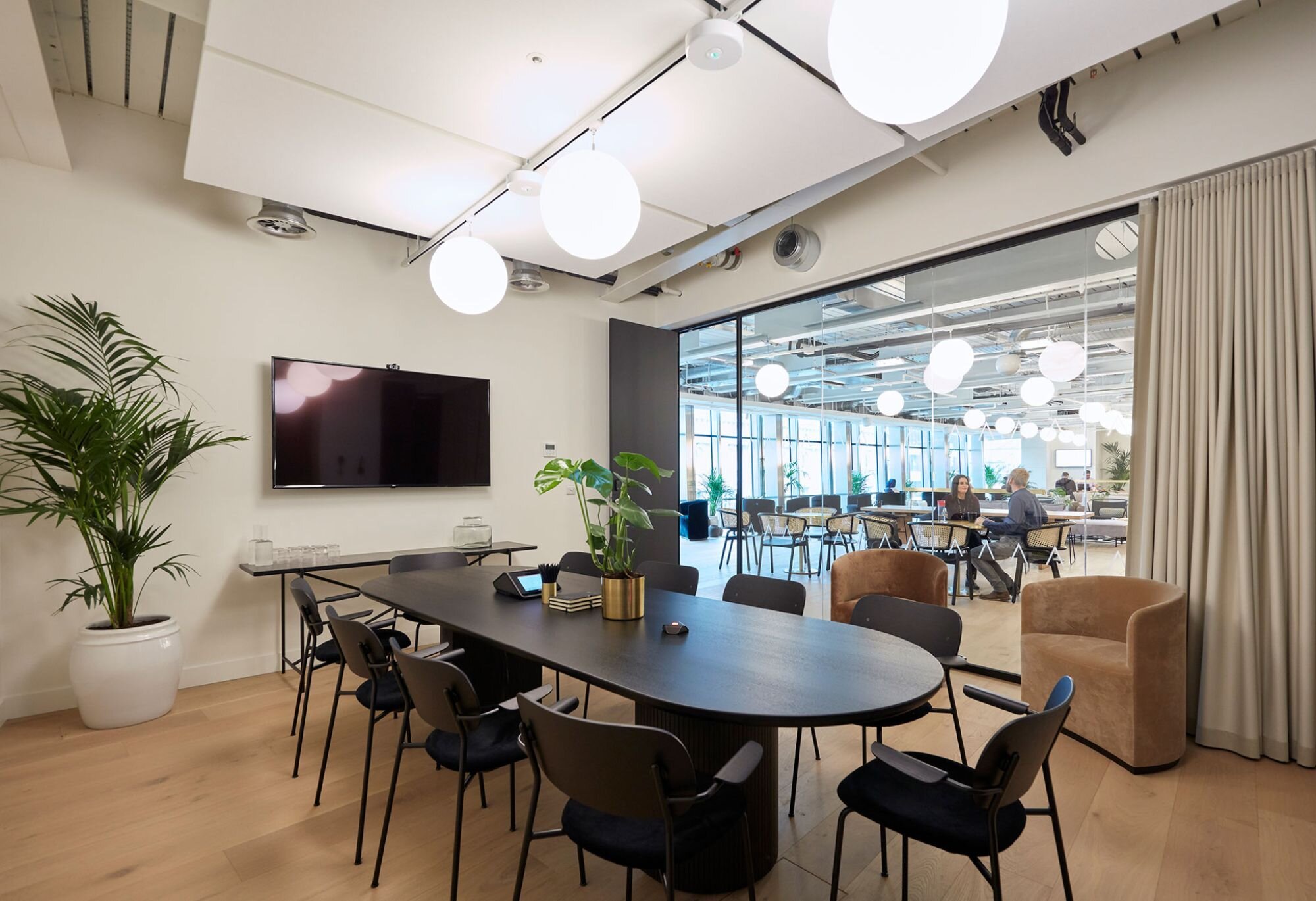 Suspended track lighting with decorative pendants at LABS 90 High Holborn, London.