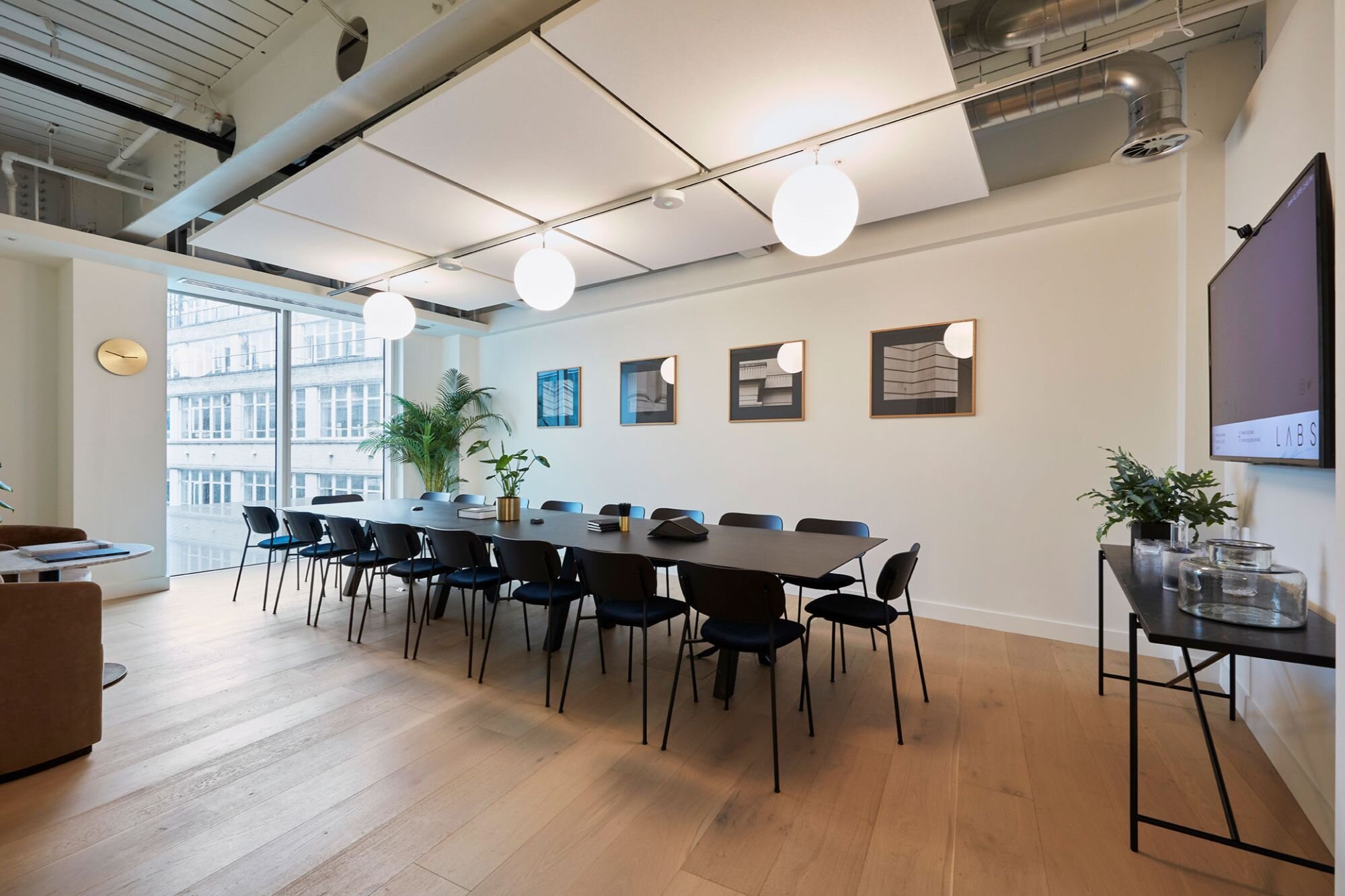 Suspended track lighting with decorative pendants at LABS 90 High Holborn, London.