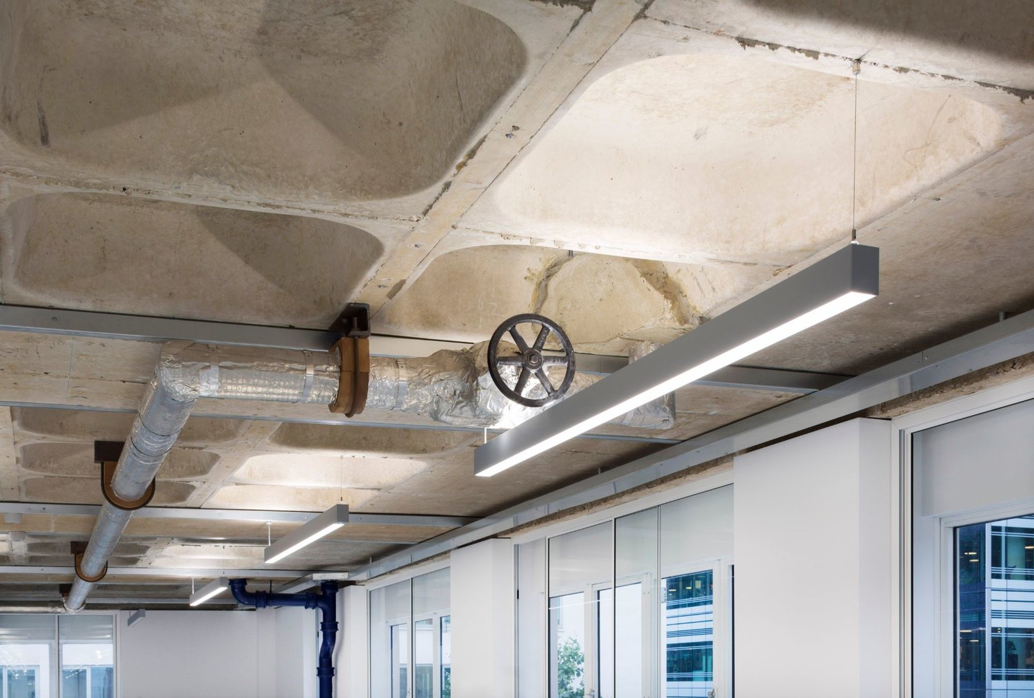 Bespoke architectural lighting for coffered slabs at Glen House, London.