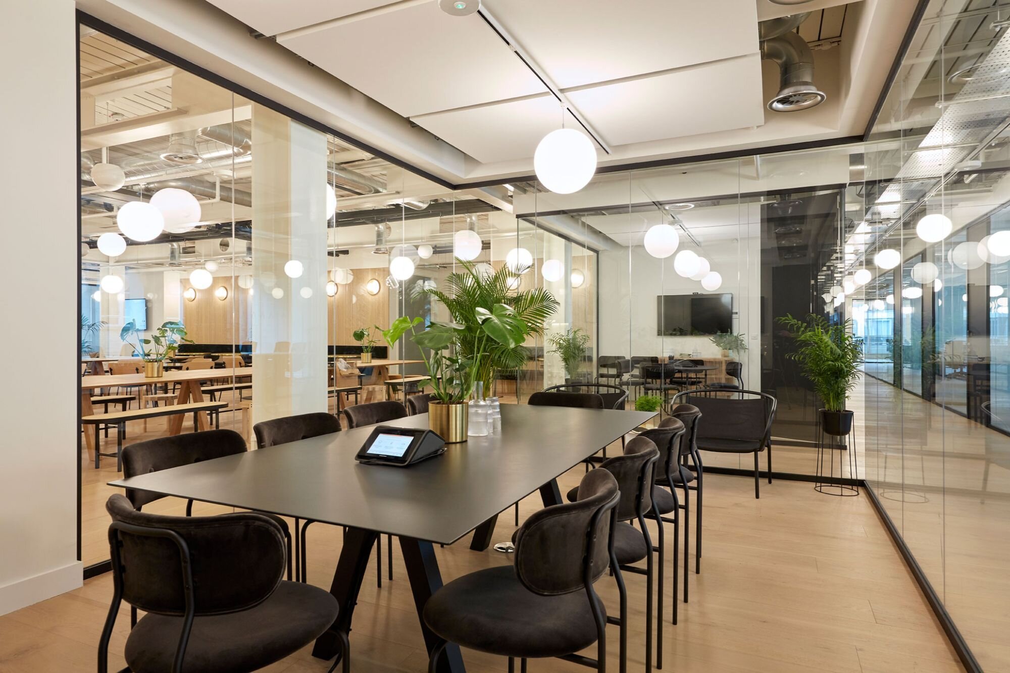 Suspended track lighting with decorative pendants at LABS 90 High Holborn, London.