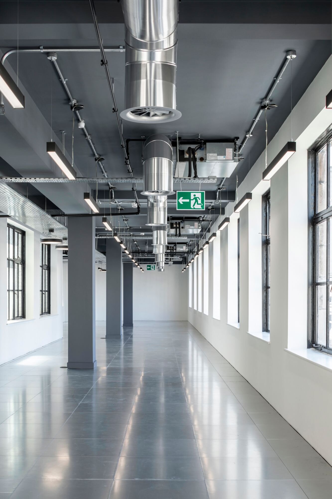 Office lighting for an industrial style CAT A fitout at 11 Old Jewry, London.