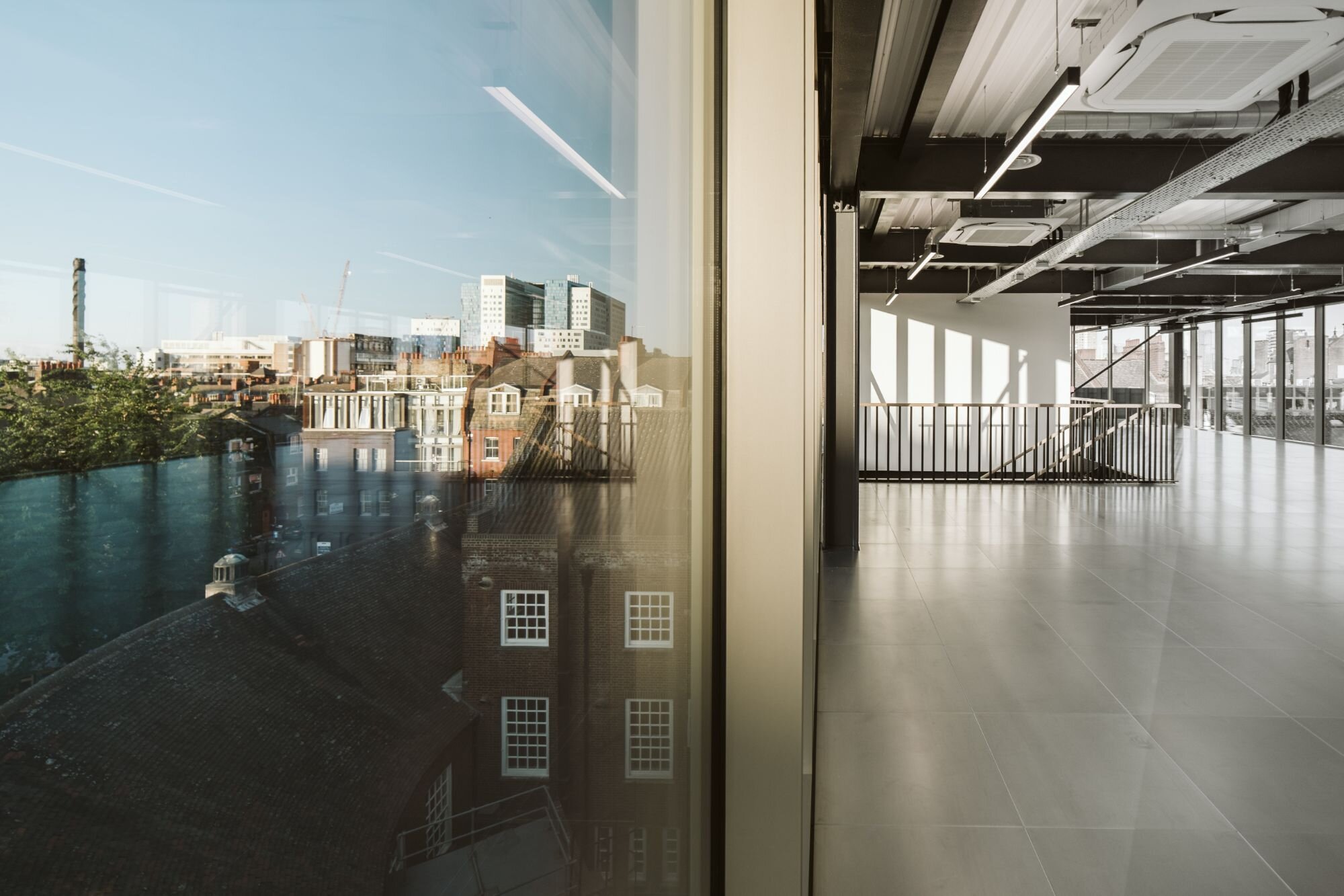 Office and architectural lighting for an office development with exposed ceilings at 13-20 Settles Street, London.