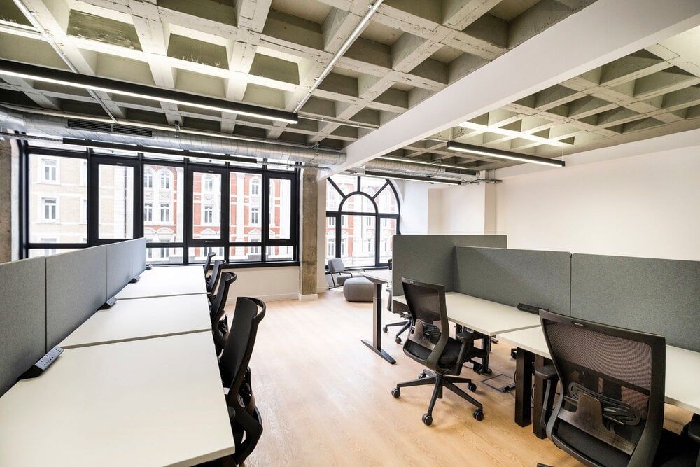 Office lighting for a CAT A fitout with concrete coffered slabs at 390 Strand, London.