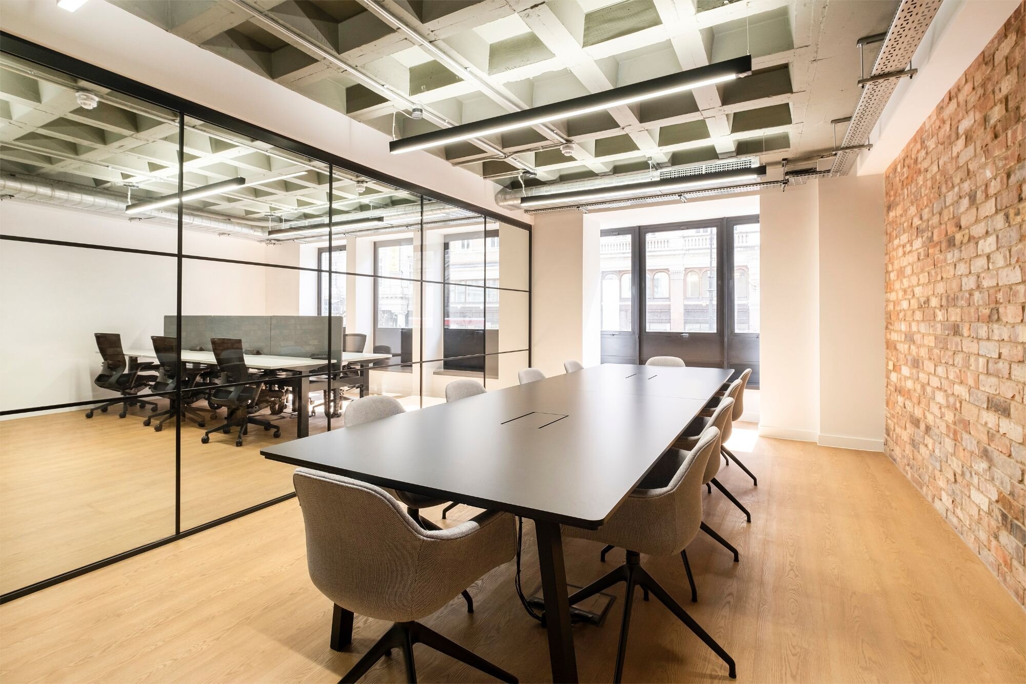 Office lighting for a CAT A fitout with concrete coffered slabs at 390 Strand, London.