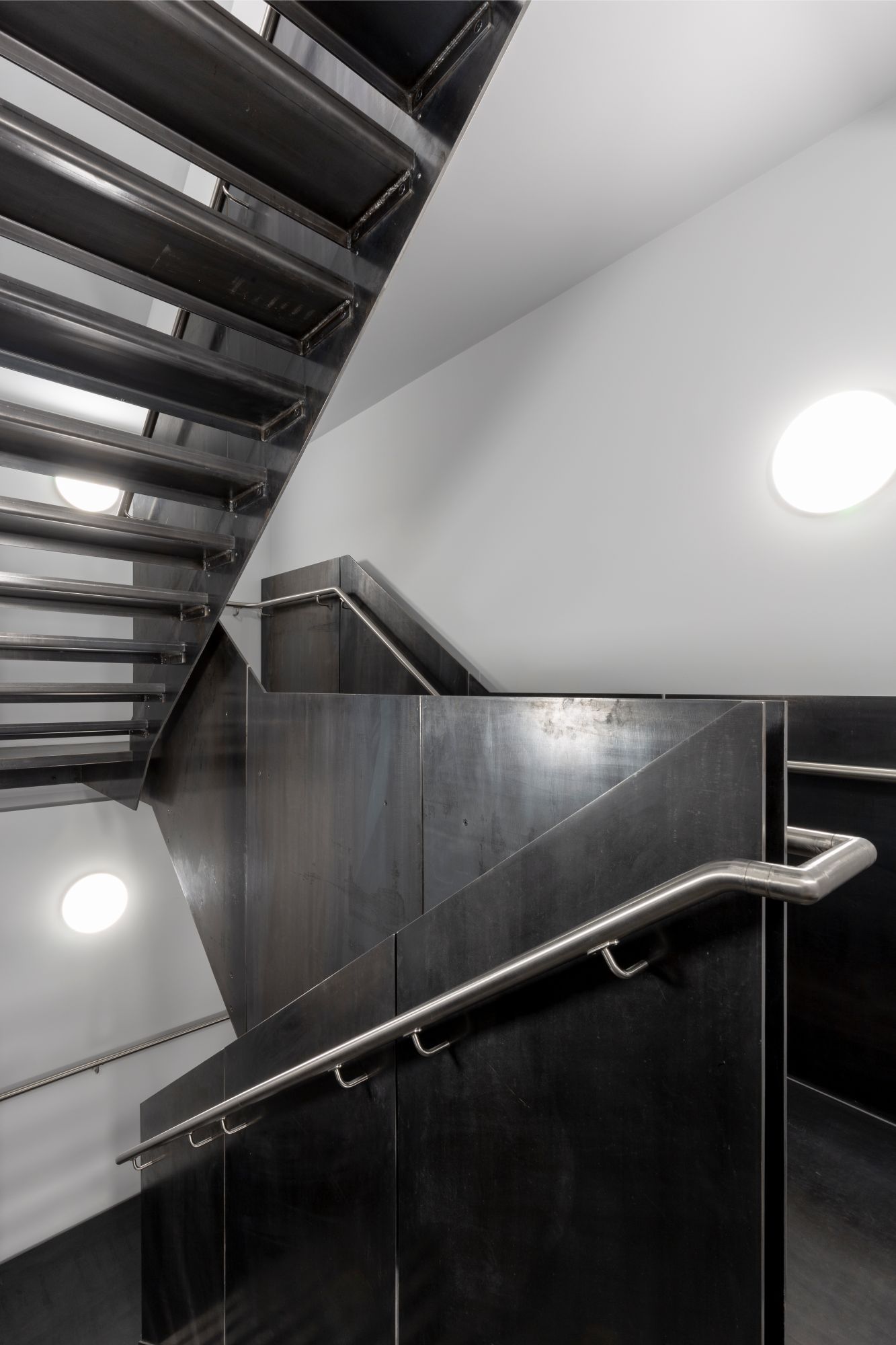 metal-staircase-wall-circular-lighting