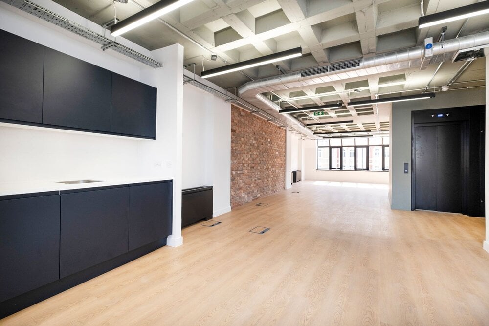 Office lighting for a CAT A fitout with concrete coffered slabs at 390 Strand, London.