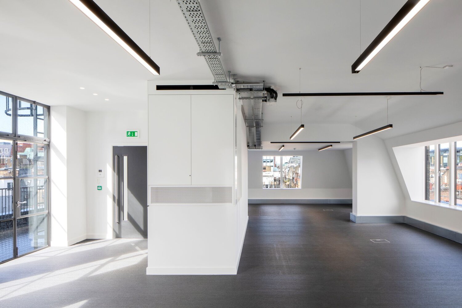 Office architectural lighting for a media style CAT A fitout at 82-84 Berwick Street, London.