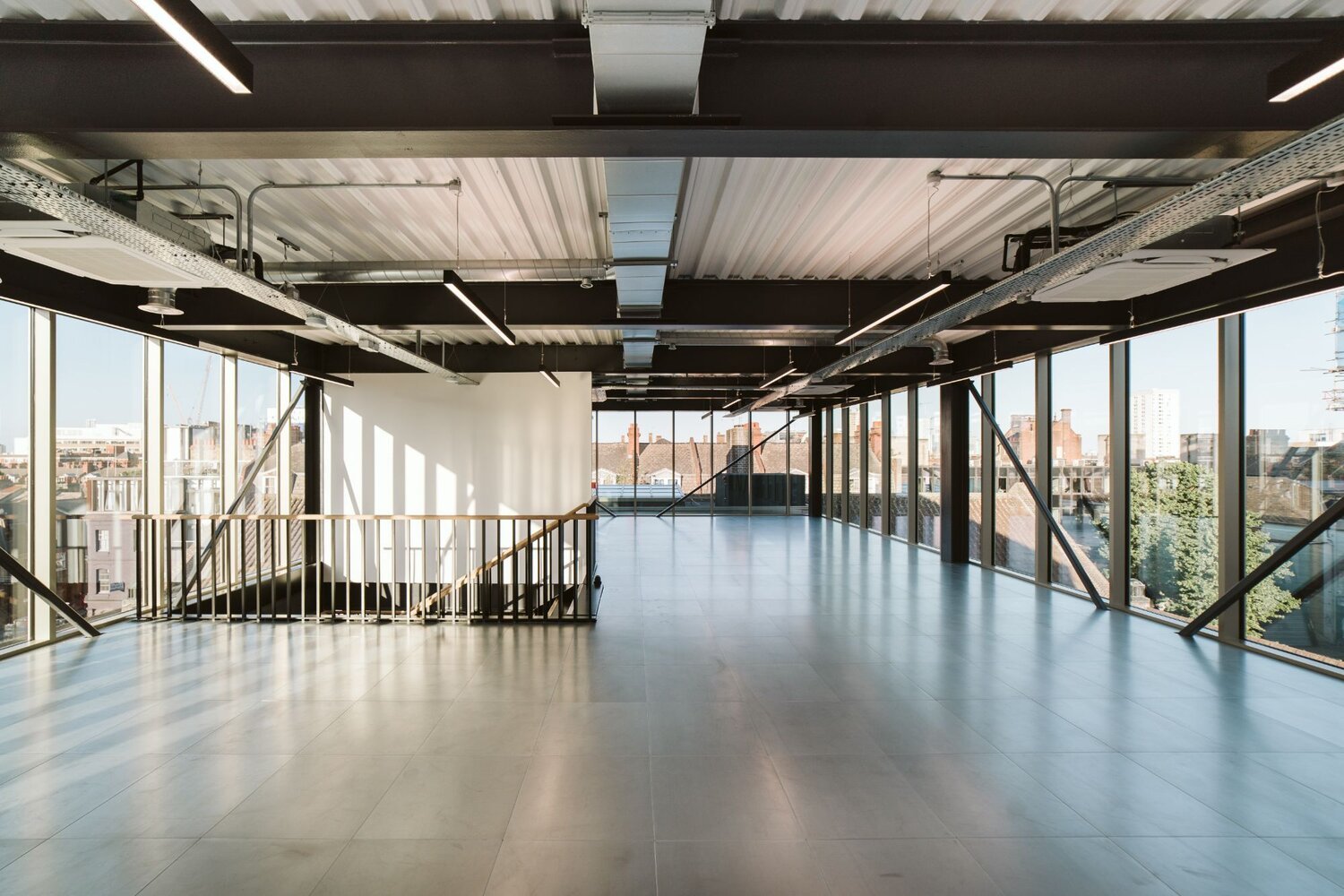 Office and architectural lighting for an office development with exposed ceilings at 13-20 Settles Street, London.