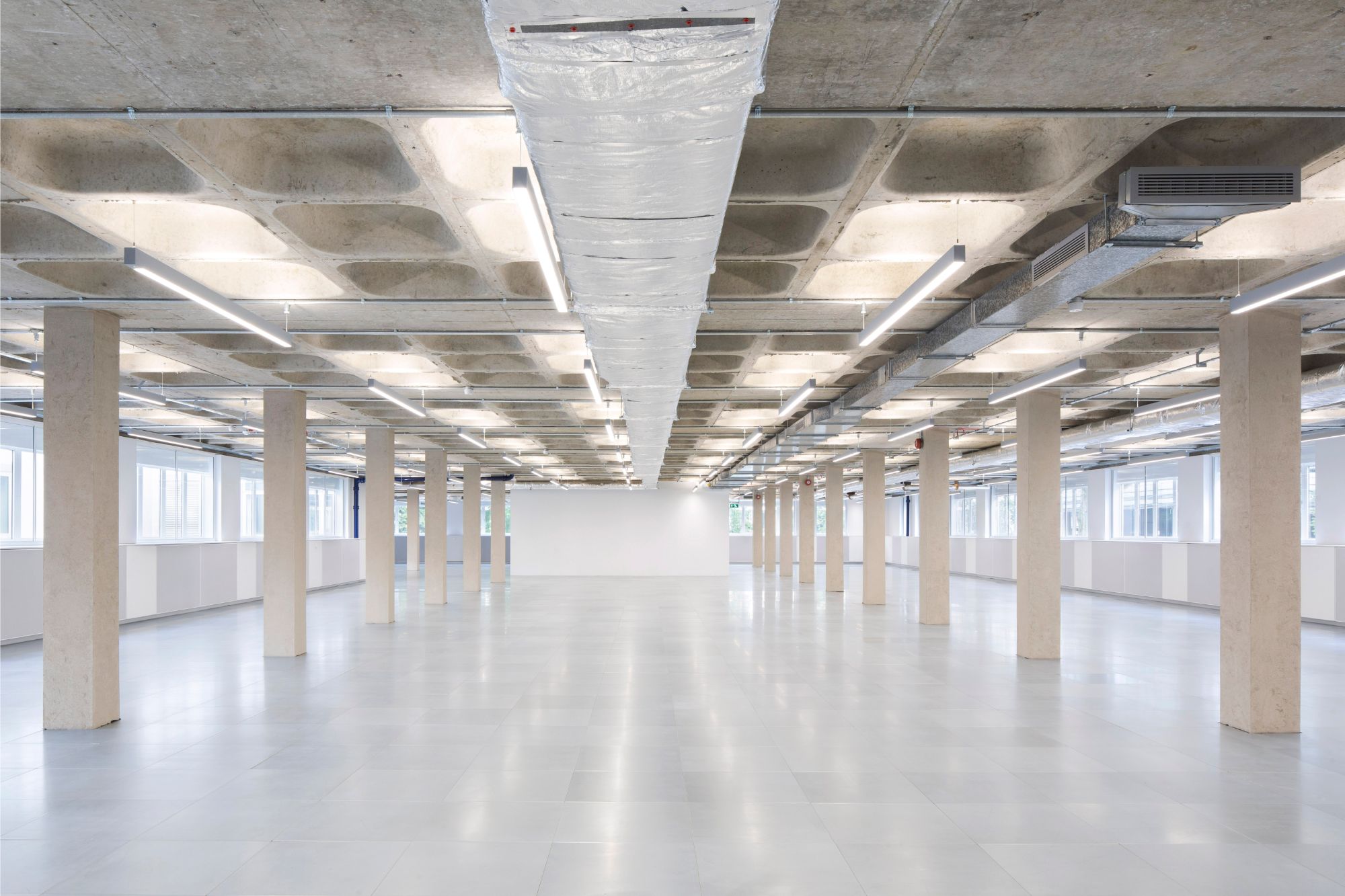 Bespoke architectural lighting for coffered slabs at Glen House, London.