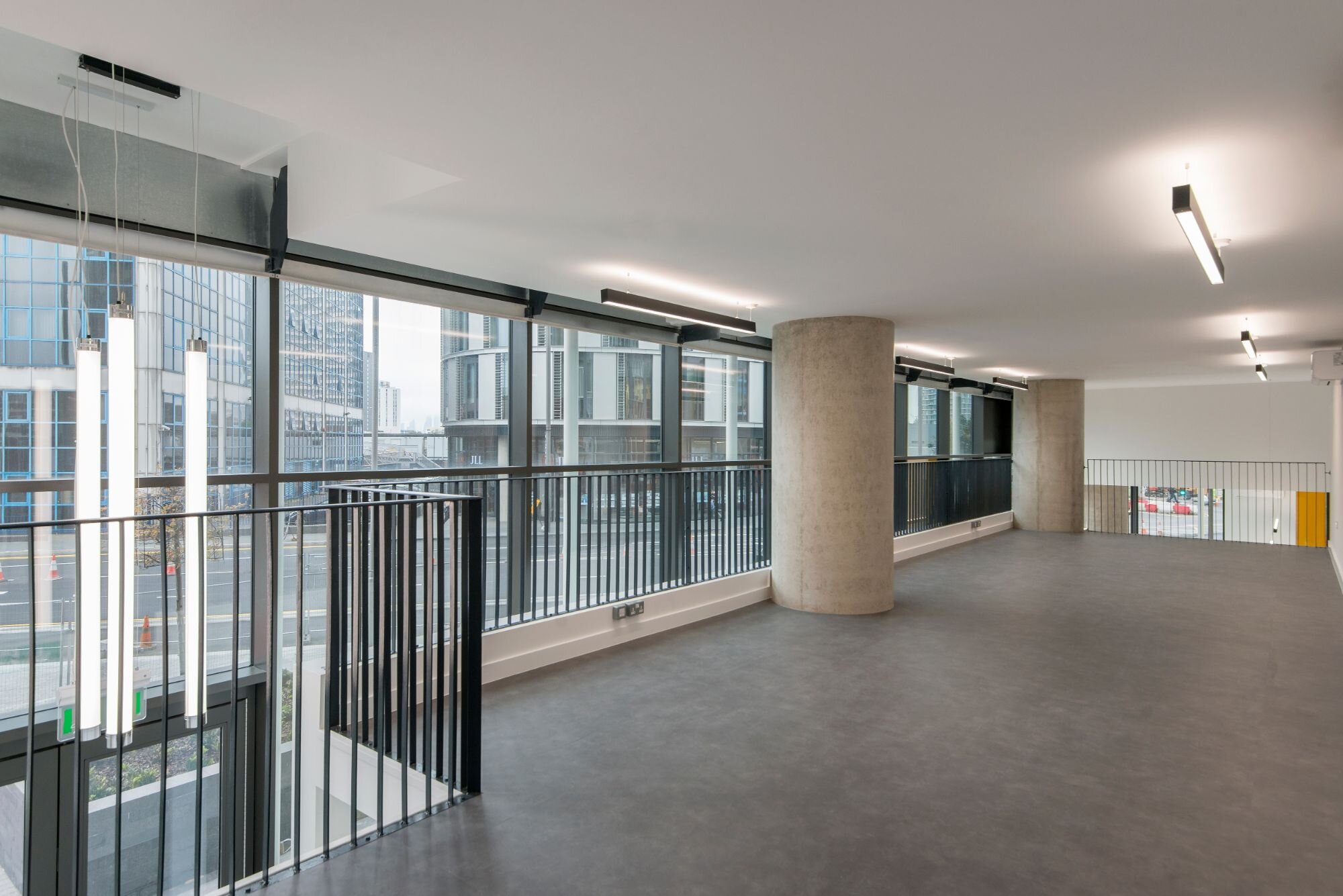 Contemporary office lighting for a CAT A fitout at Stratosphere Tower, London.