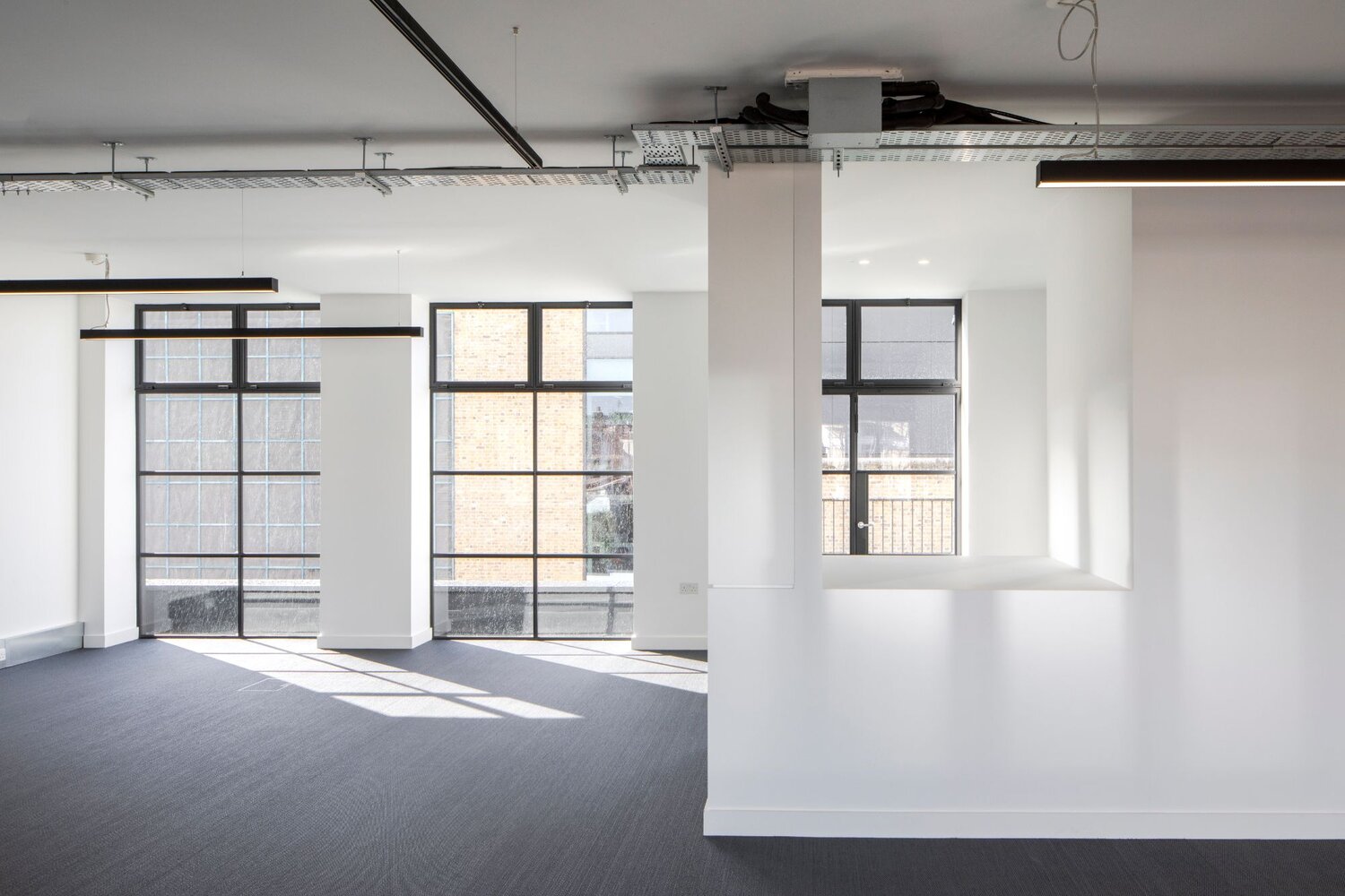 Office architectural lighting for a media style CAT A fitout at 82-84 Berwick Street, London.