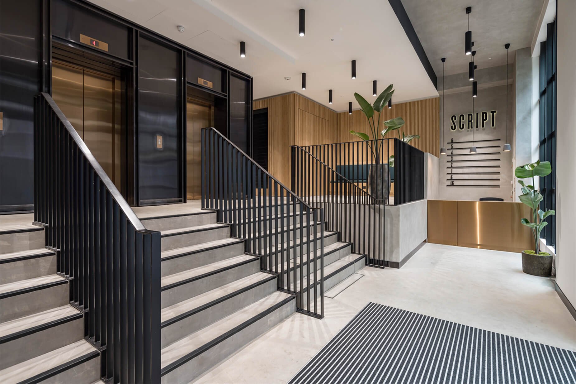 Fast-paced contemporary CAT A fitout with exposed concrete soffits at 44 Featherstone Road, London.