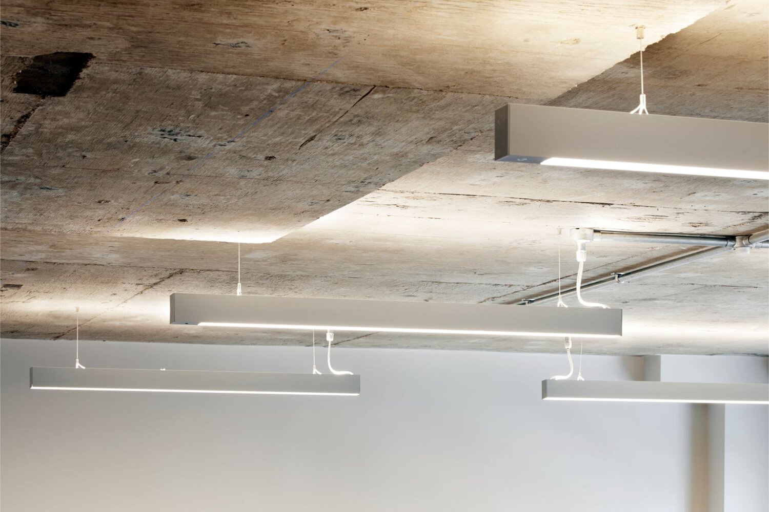 white-suspended-linear-lighting