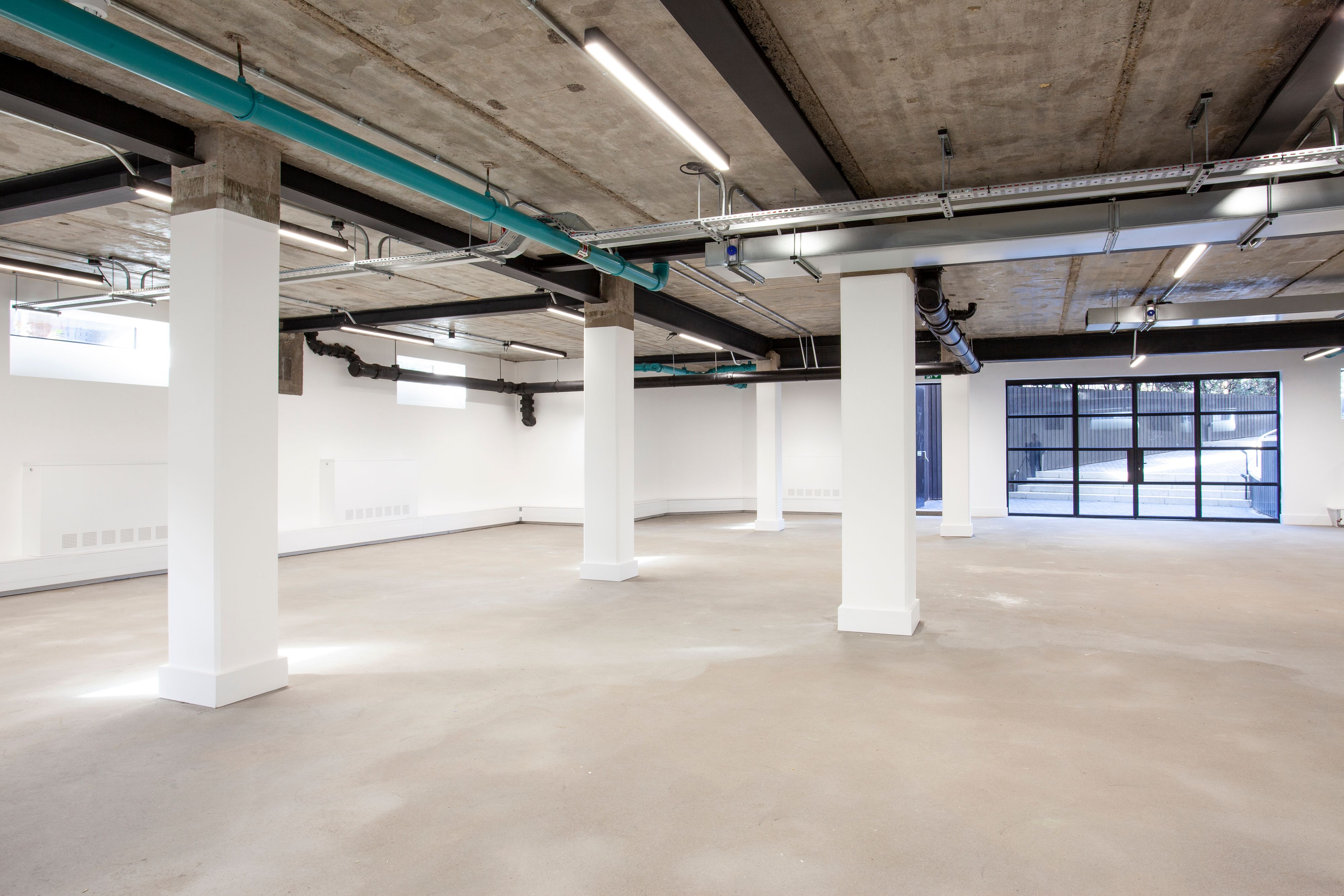 Office and architectural lighting for a warehouse style CAT A and CAT B fit out at The Hudson, 350 Kennington Lane, London.