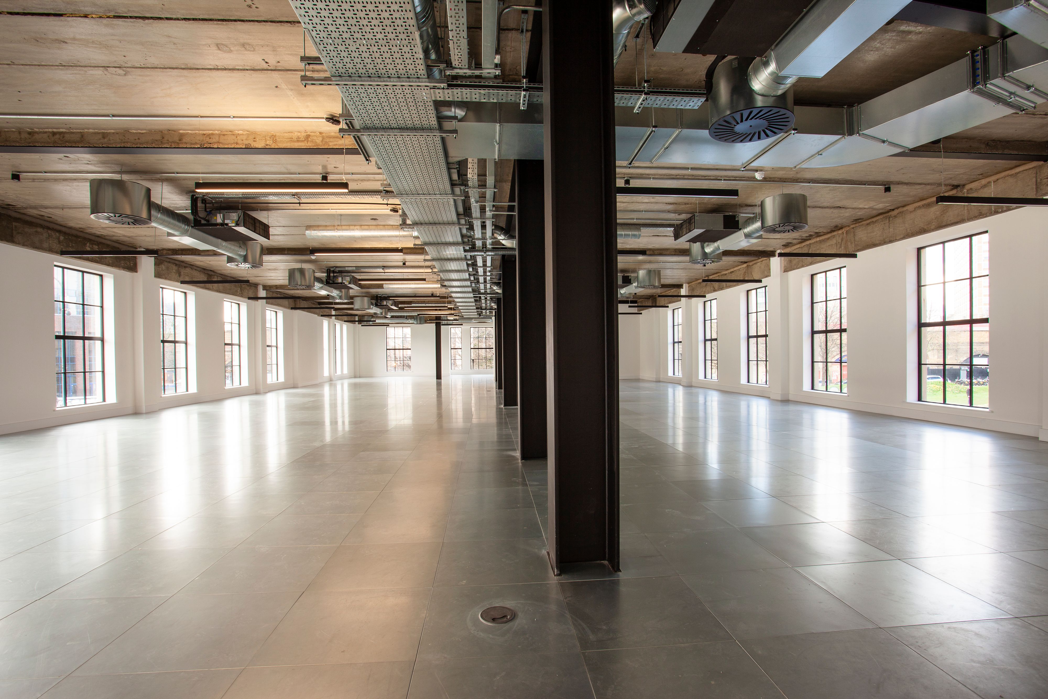 Office and architectural lighting for a warehouse style CAT A and CAT B fit out at The Hudson, 350 Kennington Lane, London.